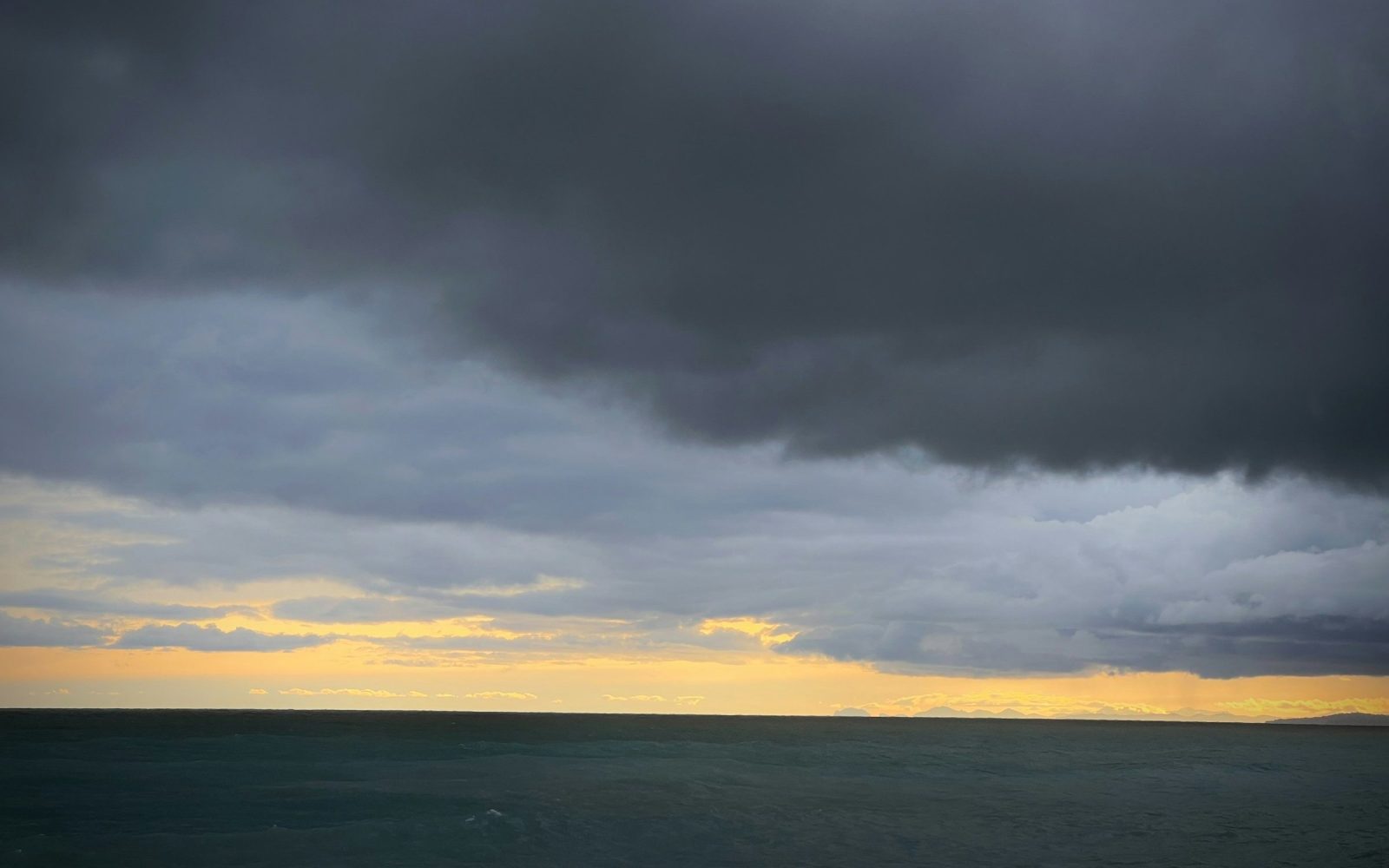Dark storm clouds over an open sea