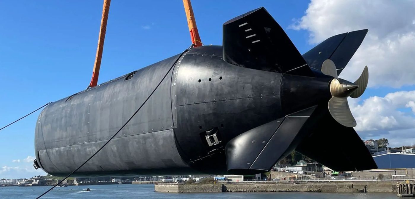 Extra-large unmanned underwater vehicle being lifted by crane